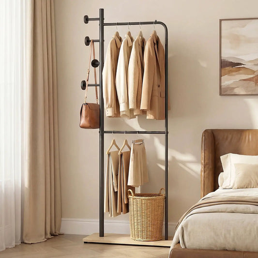 Double Rods Clothes Rack black metal with Rubber Wood Hooks; beige garments and a brown bag on Tampa Home & Garden Store