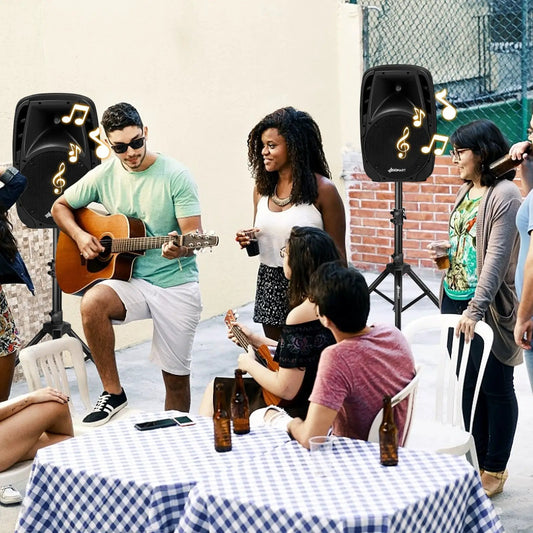 Dual 10 Inch 1600W Powered Mic Speaker Bluetooth pair on stands at an outdoor party with musicians Sonart logo on Tampa Home & Garden Store