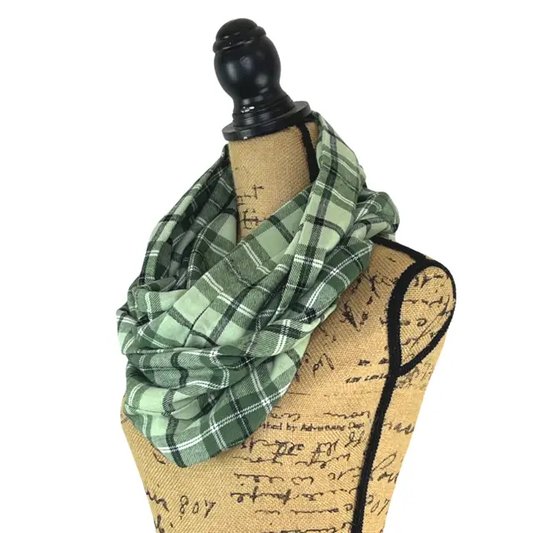 Dusty Matcha Green Plaid Flannel Infinity Scarf by Thistle & Stitch wrapped around a dress form on Tampa Home & Garden Store