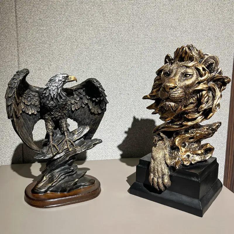 Lion head decoration in bronze finish on a black pedestal with an eagle figurine beside it on Tampa Home & Garden Store