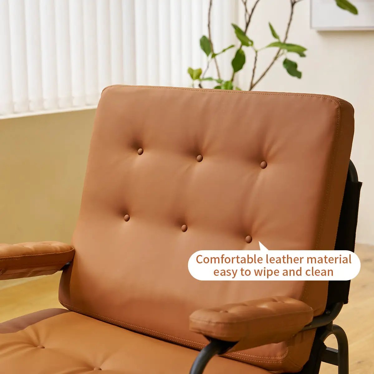 Bonded leather armchair with high back in tan, tufted backrest and padded arms on Tampa Home & Garden Store