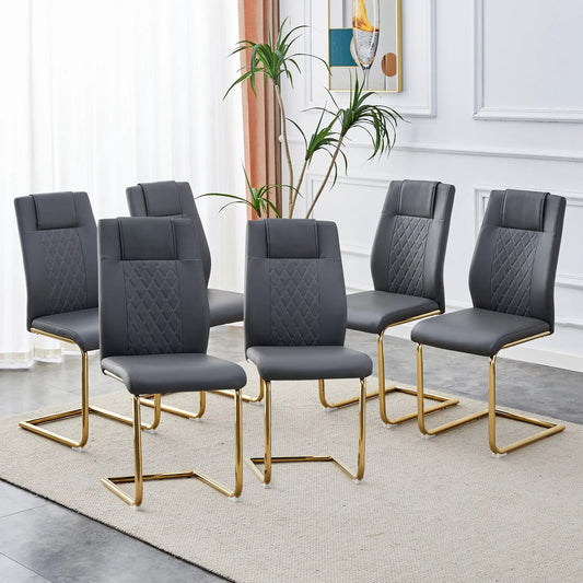 Six gray faux leather cushioned dining chairs with gold metal legs on Tampa Home & Garden Store