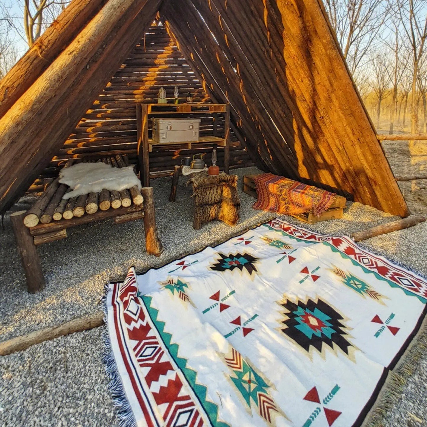 Evil Eye Beach Blanket outdoor throw rug with geometric print inside rustic log shelter on Tampa Home & Garden Store