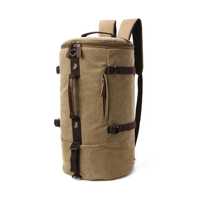 Tan canvas travel backpack with brown leather straps and zippers, top handle on Tampa Home & Garden Store