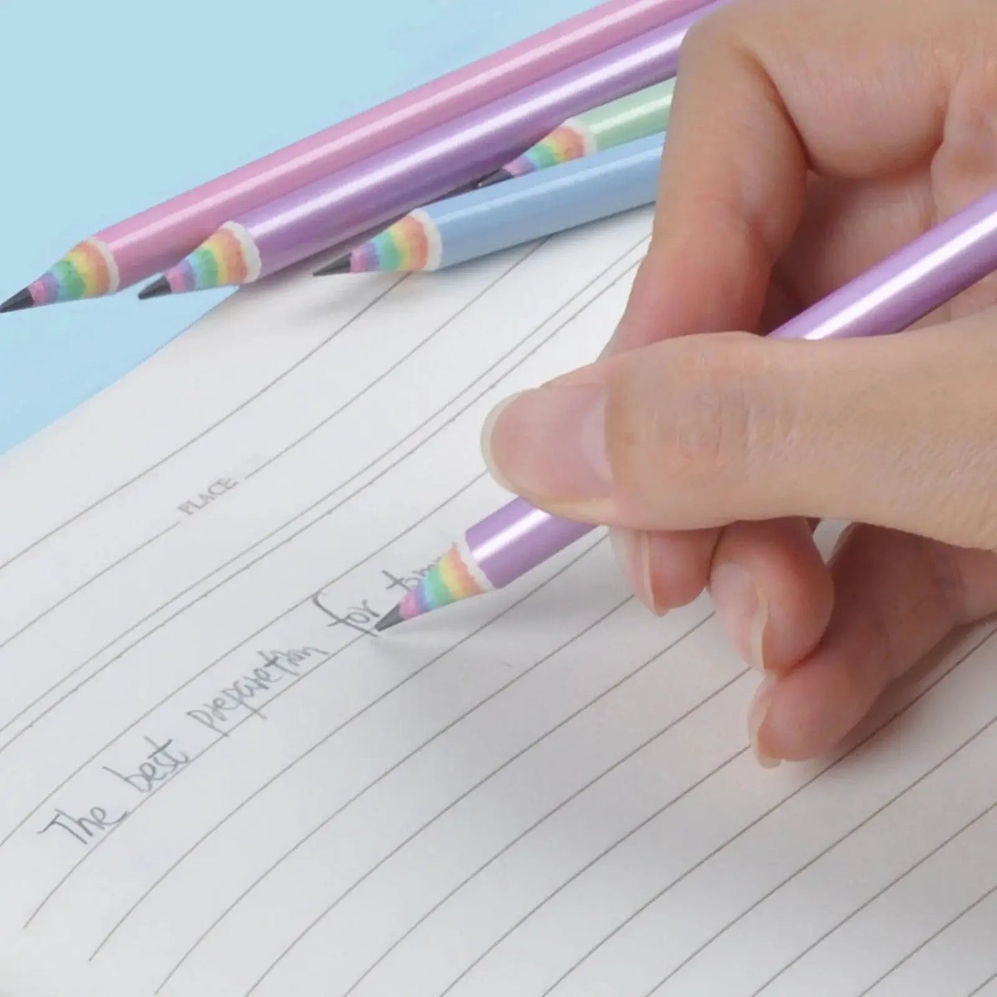 Ecotree Rainbow Woodless Pencils 24-pack, purple & blue barrels, writing on lined paper on Tampa Home & Garden Store