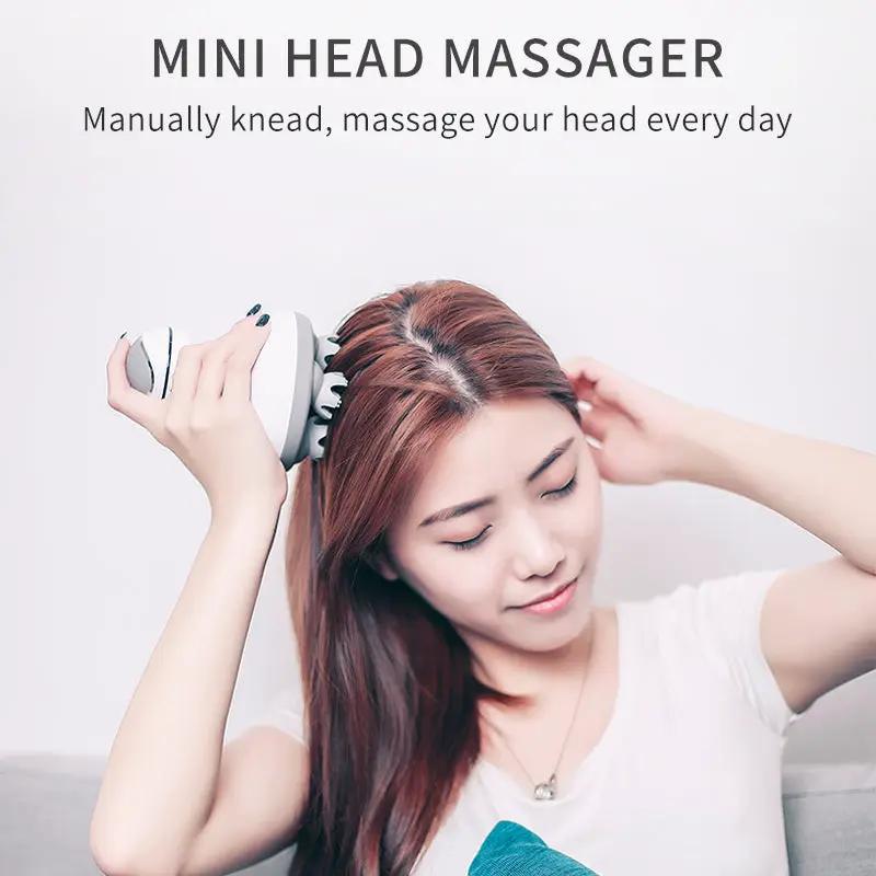 Rechargeable mini head massager with 3D scalp massage nodes, handheld gray and white device on Tampa Home & Garden Store