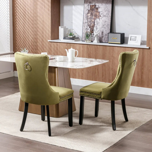 Pair of olive green velvet tufted wood dining chairs from Nikki Collection with ring pulls on Tampa Home & Garden Store