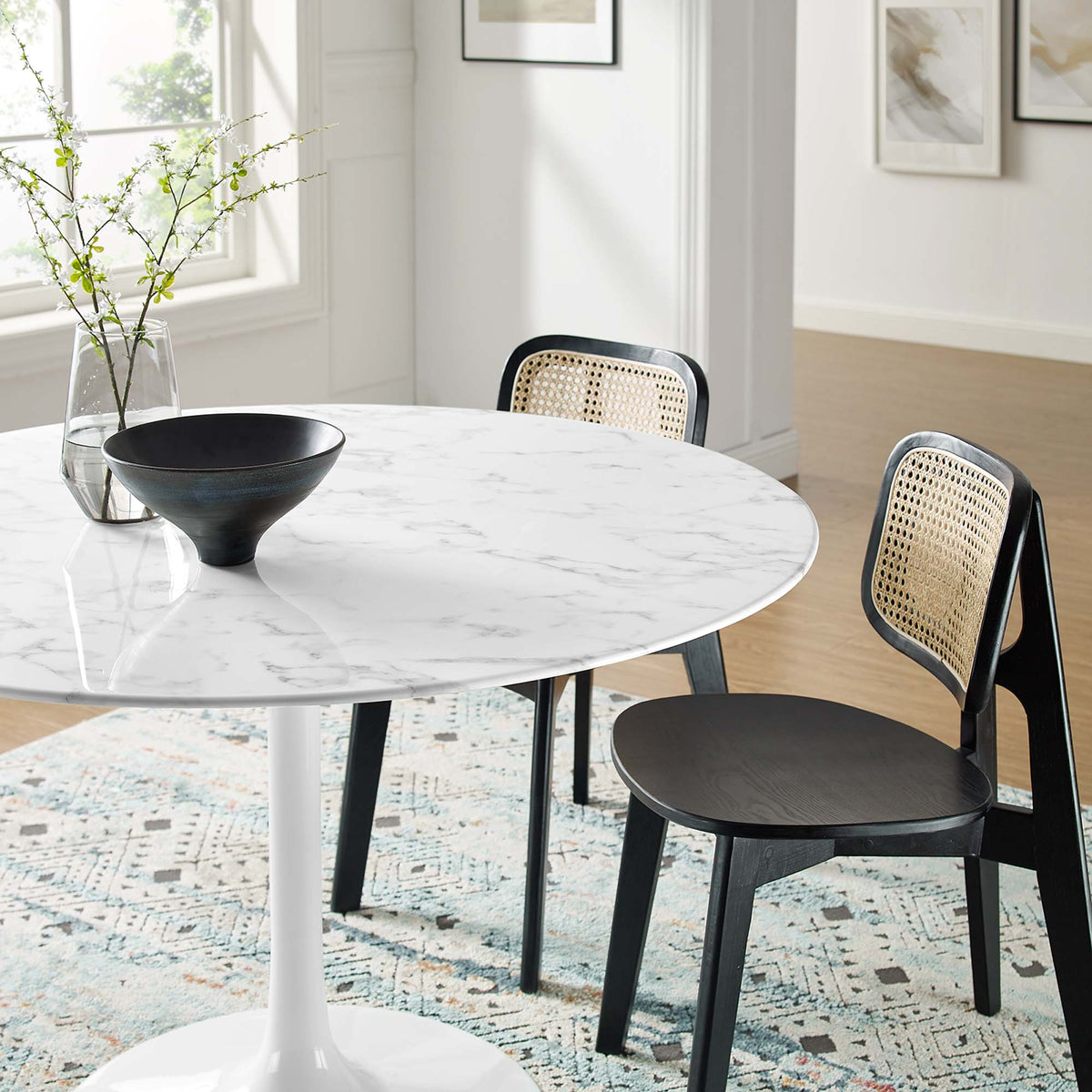 Lippa 48in Round Faux Marble Dining Table with white pedestal base and cane-back chairs on Tampa Home & Garden Store