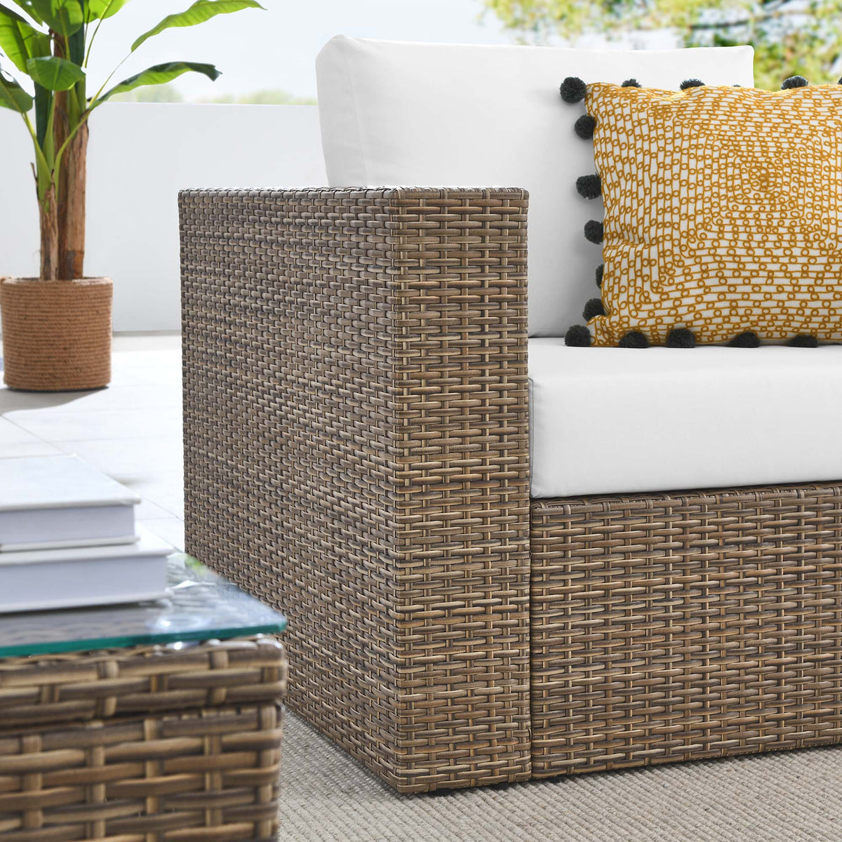 Convene 3-Piece outdoor wicker sofa set with white cushions and a mustard pillow with pom-poms on Tampa Home & Garden Store