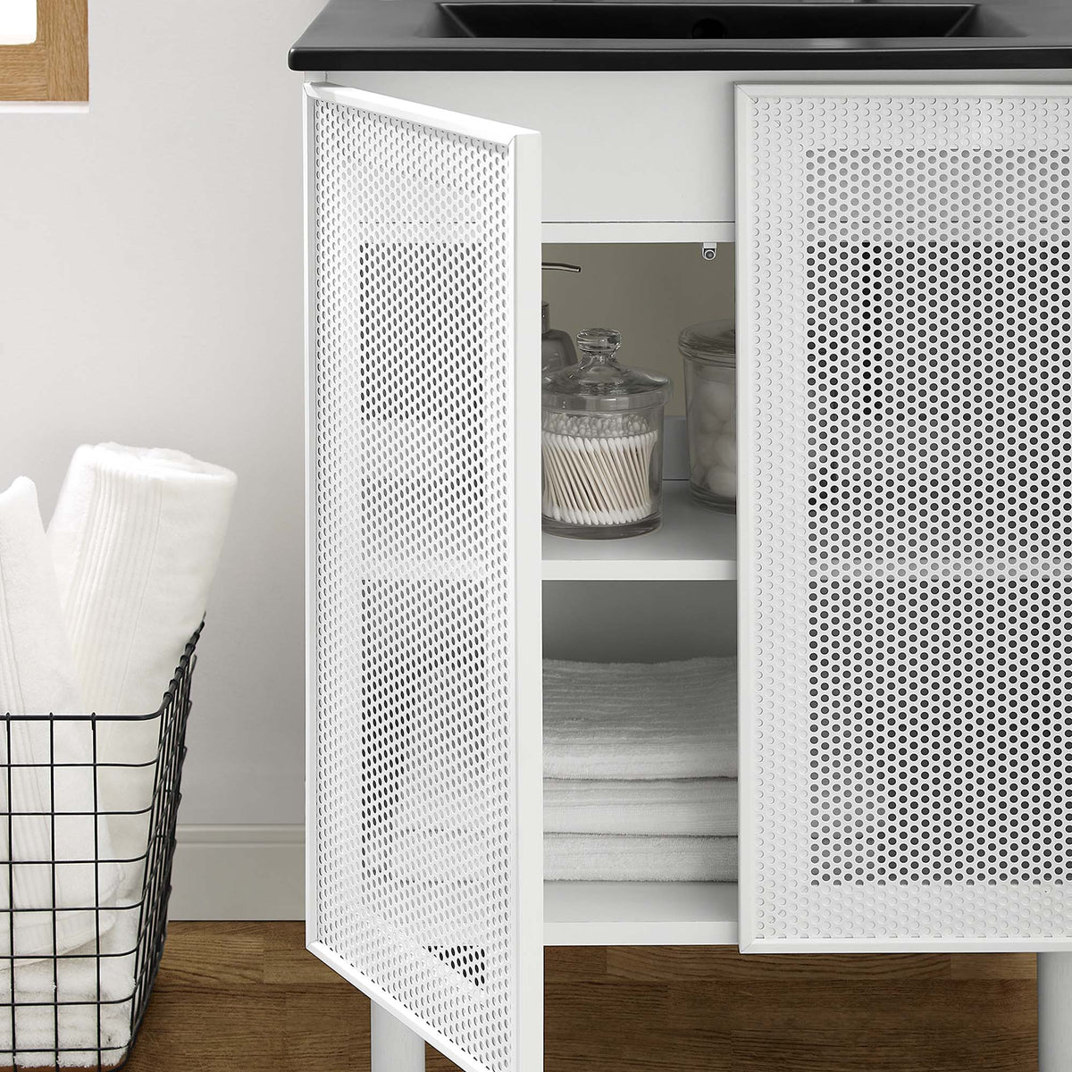 Calla 24-inch perforated metal bathroom vanity with white frame and perforated doors; interior shelf visible on Tampa Home & Garden Store