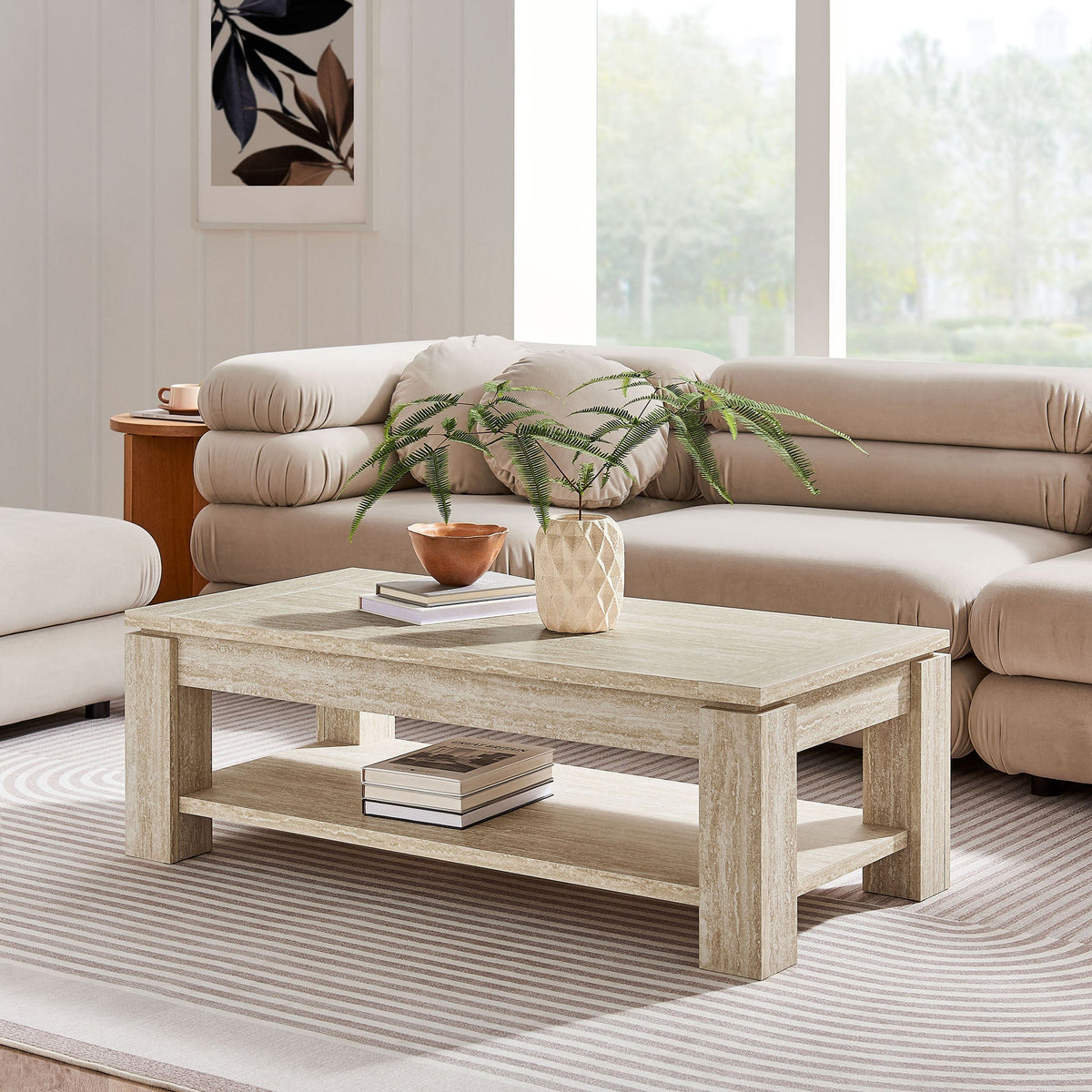 Hollis Travertine coffee table with beige stone finish and two-tier shelf in a modern living room on Tampa Home & Garden Store