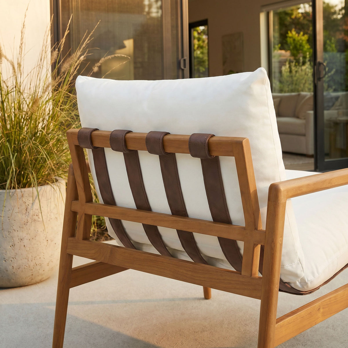 Nomi Outdoor Patio Teak Wood Sling Chair with white cushion and brown leather straps on Tampa Home & Garden Store