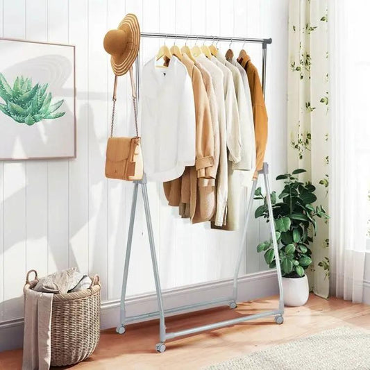 Folding metal garment rack with lockable wheels, gray frame, clothes hung neatly on Tampa Home & Garden Store