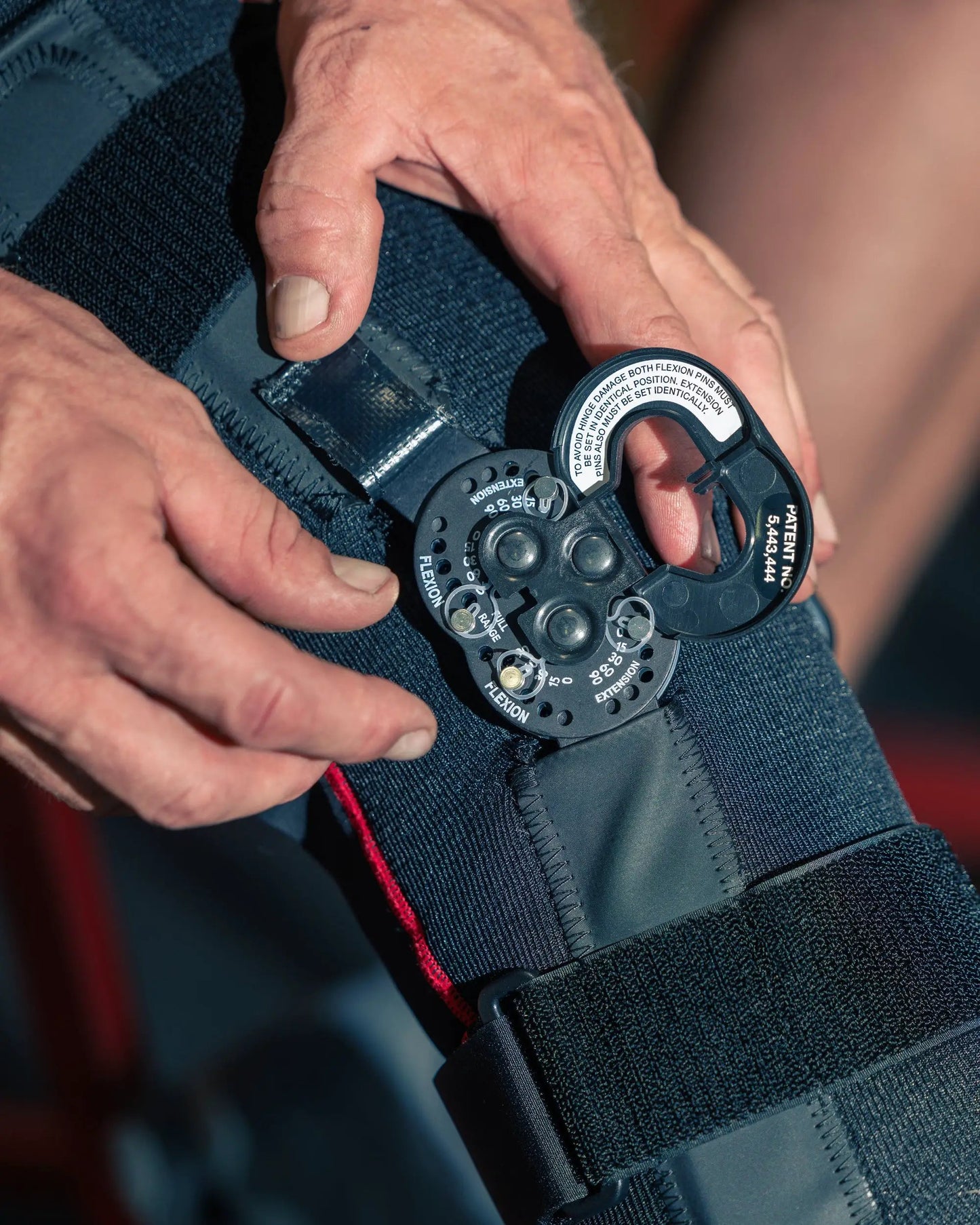 SX02 Knee Brace with Polycentric Hinges by EVS Sports in dark blue with Velcro straps on Tampa Home & Garden Store