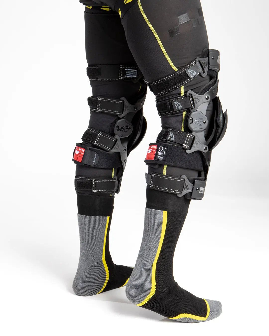 Axis Sport 2025 Knee Brace for Track worn on legs with black straps and gray hinge shells on Tampa Home & Garden Store