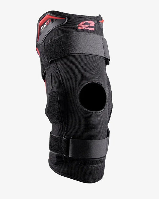 EVS SX01 knee brace with polycentric hinges, black neoprene, red accents, patella hole, Velcro straps on Tampa Home & Garden Store