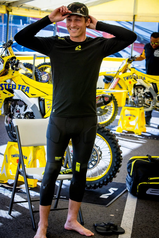 Tug Impact 3/4 Pant Winter undergear, black compression pants with yellow logo worn by racer on Tampa Home & Garden Store