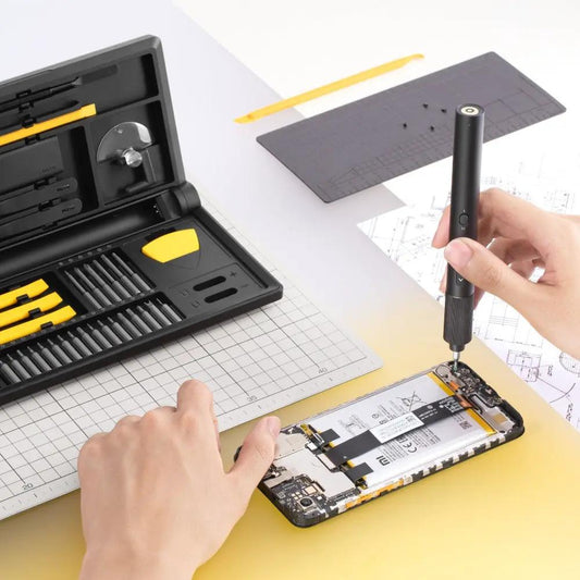 Electric Precision Screwdriver Kit Pro by HOTO with yellow bit set repairing smartphone on Tampa Home & Garden Store