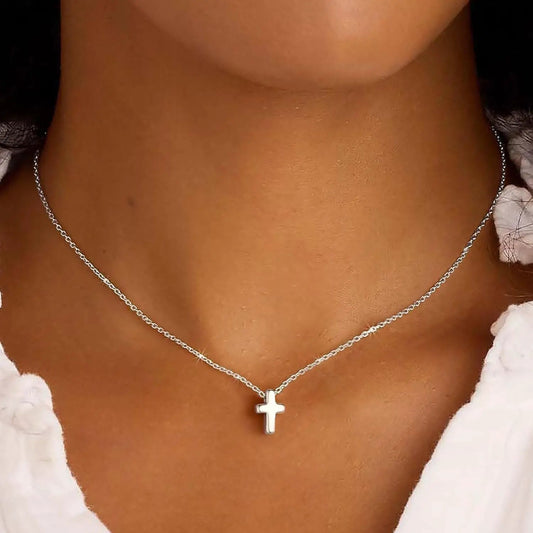 Silver cross pendant necklace on a delicate chain on Tampa Home & Garden Store