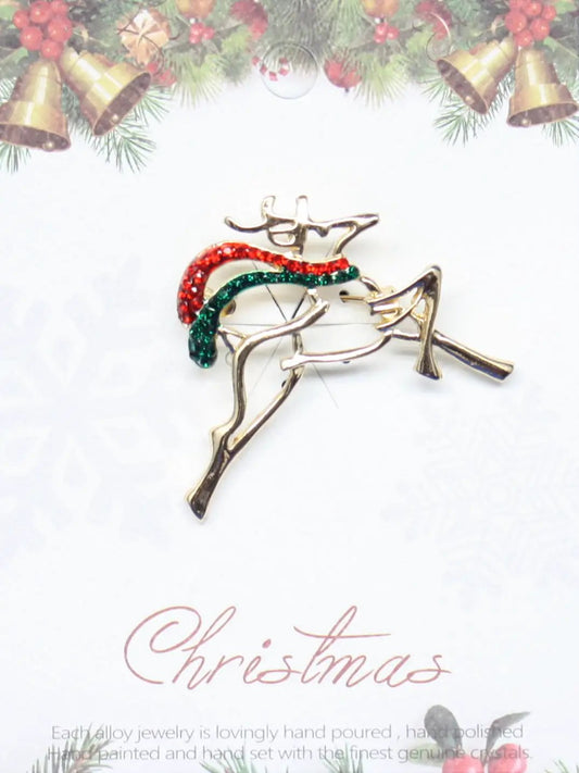 Enamel Reindeer Pin with red and green gem accents on gold-tone metal brooch on Tampa Home & Garden Store