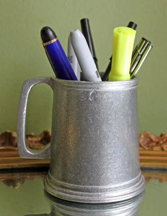 English pewter beer mug with handle repurposed as a pen holder with assorted pens on Tampa Home & Garden Store