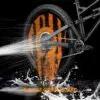 Enlee Bicycle Grime Guard wheel cover on a black bike wheel with orange rim on Tampa Home & Garden Store