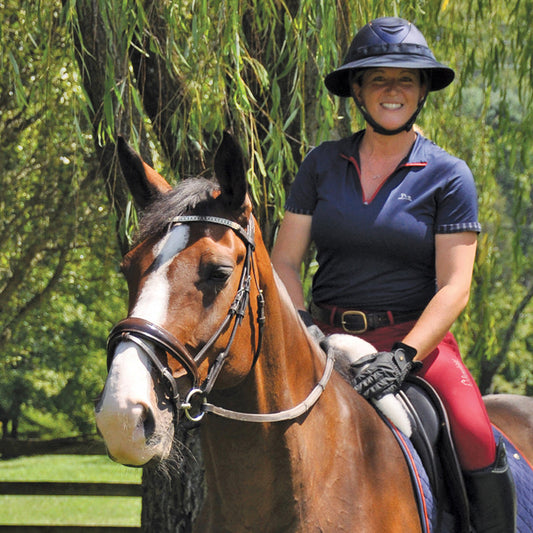 EquiVisor Original Sun Protection sun visor worn by rider on navy helmet atop a horse on Tampa Home & Garden Store