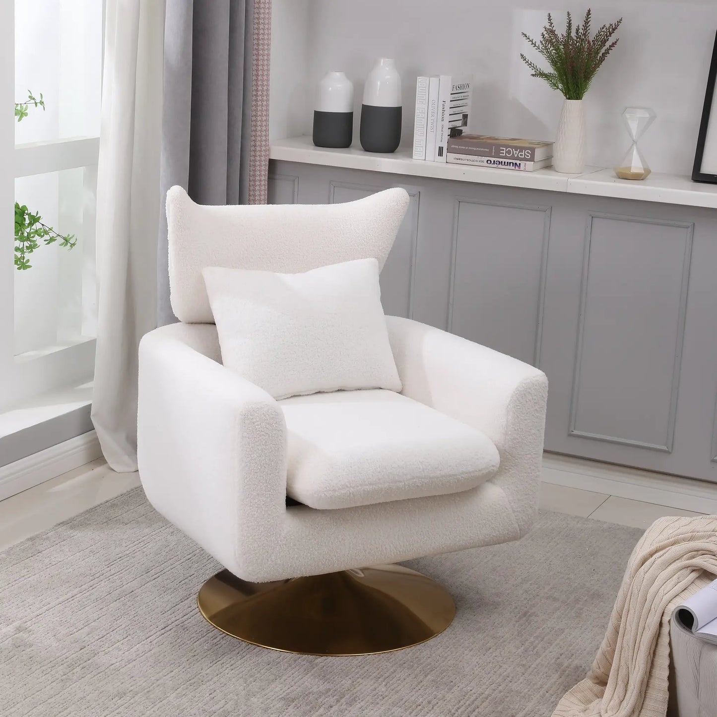 Classic mid-century 360-degree swivel chair in white boucle fabric with brass pedestal base on Tampa Home & Garden Store