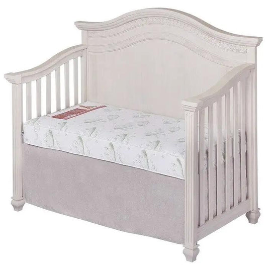 6 Inch Firm Spring Crib Mattress Waterproof in a white crib with arched headboard and slats on Tampa Home & Garden Store