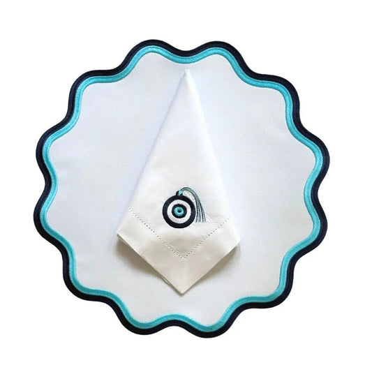 Mykonos napkin featuring evil eye embroidery, white cloth with turquoise eye, by Talah Home on Tampa Home & Garden Store