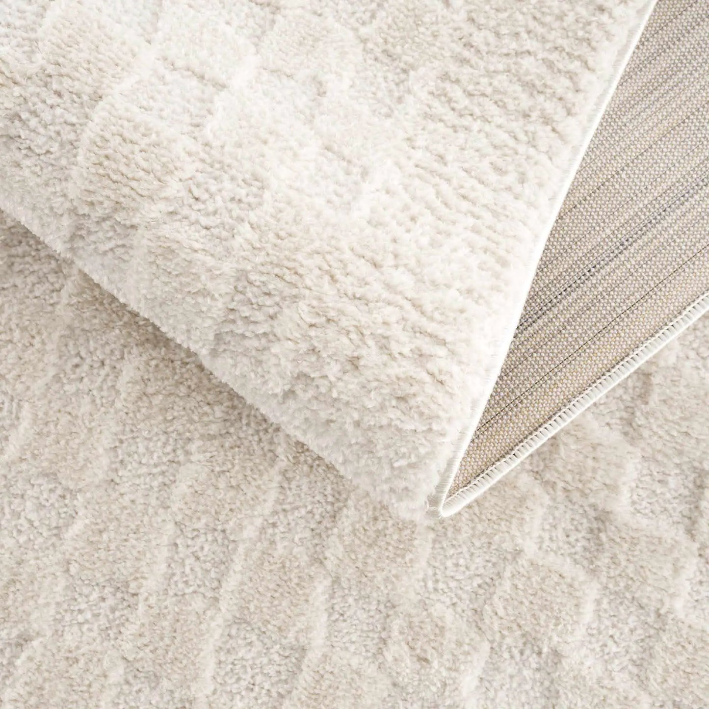 Leryn Ivory Checkered High Pile Area Rug with plush ivory pile and beige woven edge on Tampa Home & Garden Store