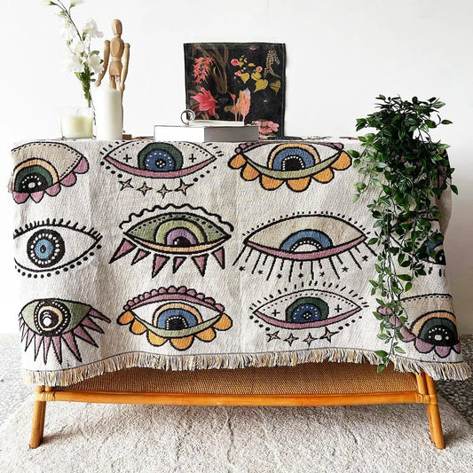 Evil Eye Beach Blanket woven throw with eye motifs, beige base and fringed edges on Tampa Home & Garden Store