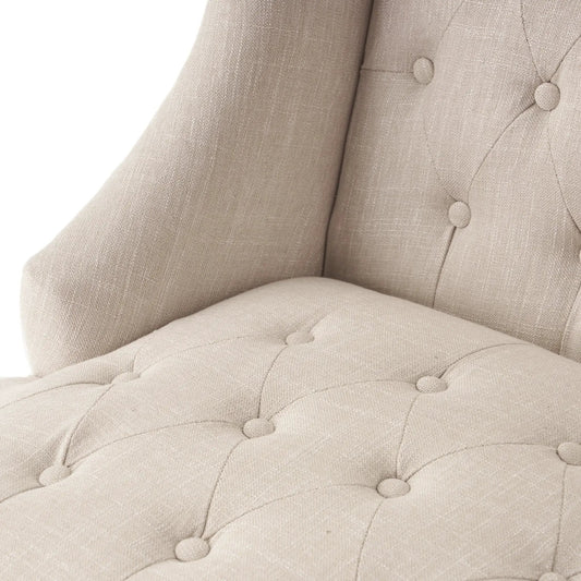 Light beige fabric club chair with tufted back and button details on Tampa Home & Garden Store