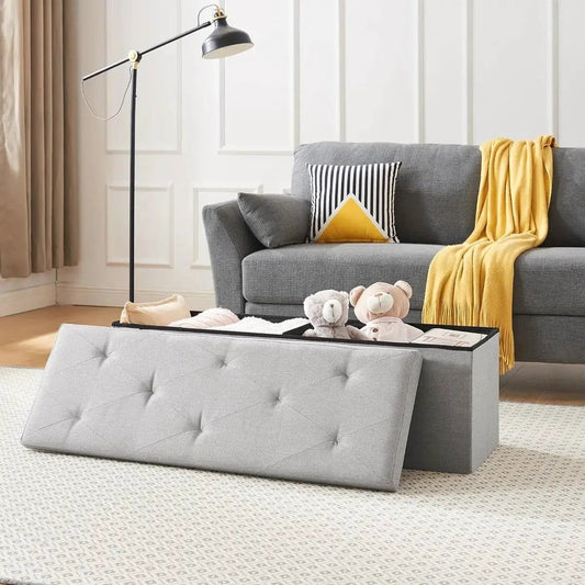 Two light grey linen upholstered bench ottomans with tufted lids and storage by HomePacific on Tampa Home & Garden Store