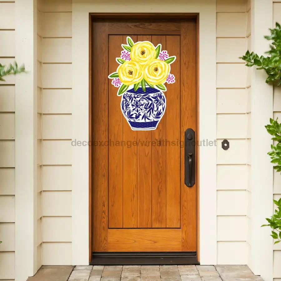 22-inch Door Hanger with yellow floral bouquet in blue vase on wood door by DecoExchange on Tampa Home & Garden Store