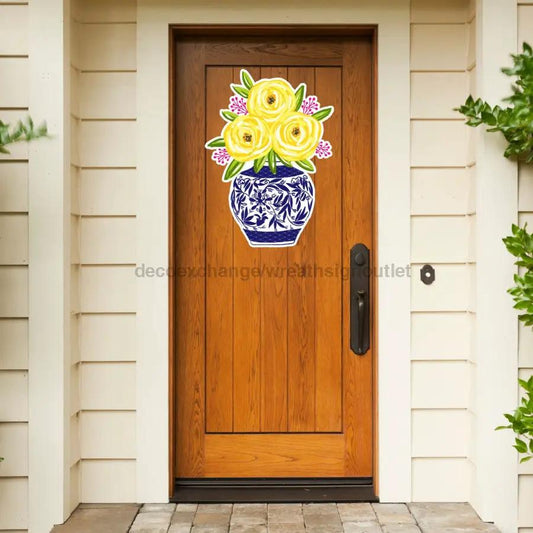 22-inch Door Hanger with yellow floral bouquet in blue vase on wood door by DecoExchange on Tampa Home & Garden Store