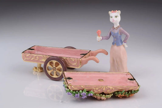 Enamel cat figurine beside pink carriage trinket boxes with Austrian crystals on Tampa Home & Garden Store