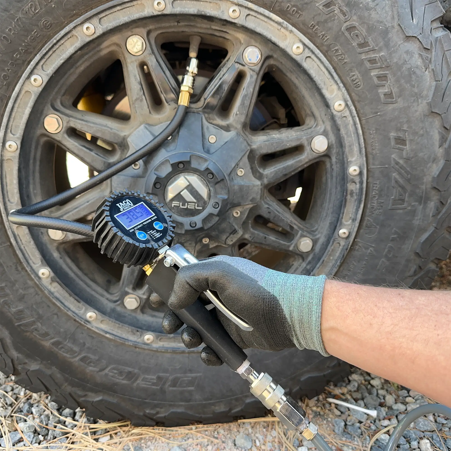 FlowPro 2.0 Tire Inflator with Gauge attached to tire valve on rugged wheel JACO gauge on Tampa Home & Garden Store
