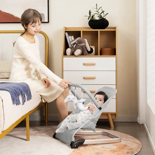 Foldable baby bouncer with removable gray fabric cover and toy bar on Tampa Home & Garden Store