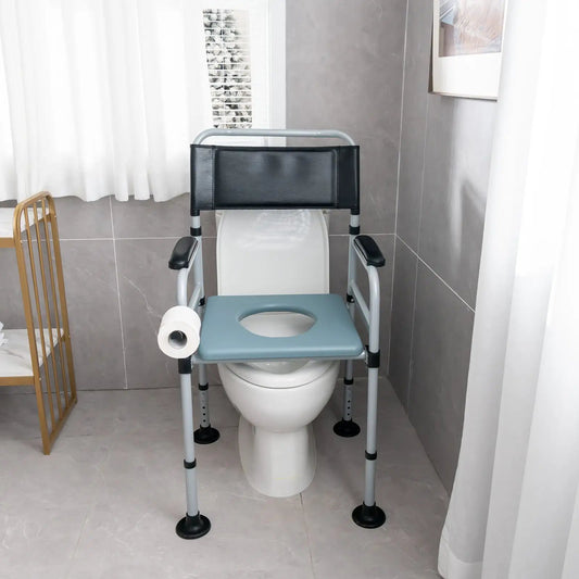 Folding bedside commode chair with bucket, gray frame, seat, padded backrest over toilet on Tampa Home & Garden Store