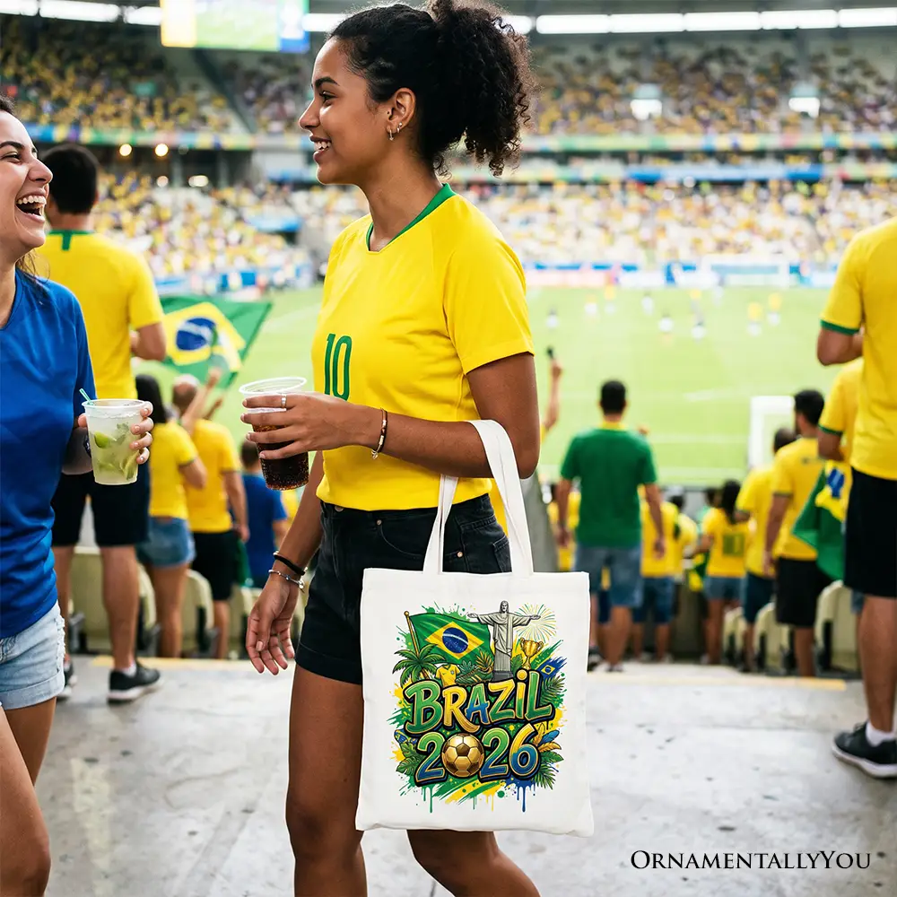 White tote bag with Brazil 2026 graphic and flag, carried by fan in yellow jersey OrnamentallyYou on Tampa Home & Garden Store