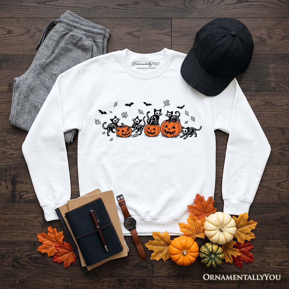 Skeleton Cats and Pumpkins Sweatshirt with black cats and pumpkins on white fabric on Tampa Home & Garden Store