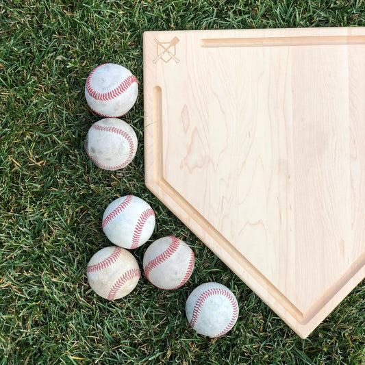Full size home plate cutting board with trough, light wood finish, Baseball BBQ logo on grass on Tampa Home & Garden Store