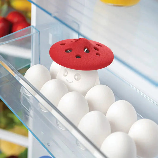 OTOTO Fun Guy fridge odor absorber mushroom, red cap on white figure among eggs in fridge on Tampa Home & Garden Store