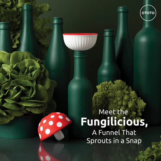 Fungilicious foldable kitchen funnel OTOTO DESIGN white with red rim on green bottles OTOTO logo on Tampa Home & Garden Store