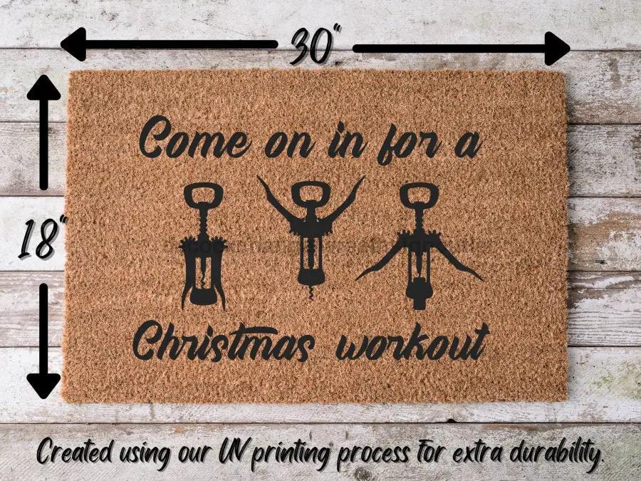 Door Mat Funny Christmas Workout DecoExchange brown coir with three figures on Tampa Home & Garden Store