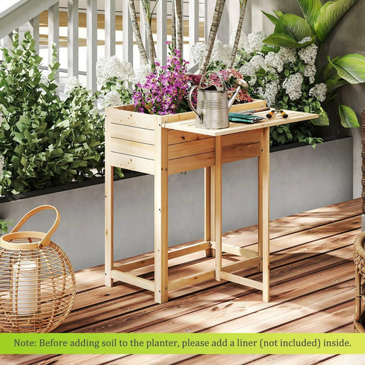 Wooden raised garden bed with legs and side table on a deck, filled with flowering plants on Tampa Home & Garden Store