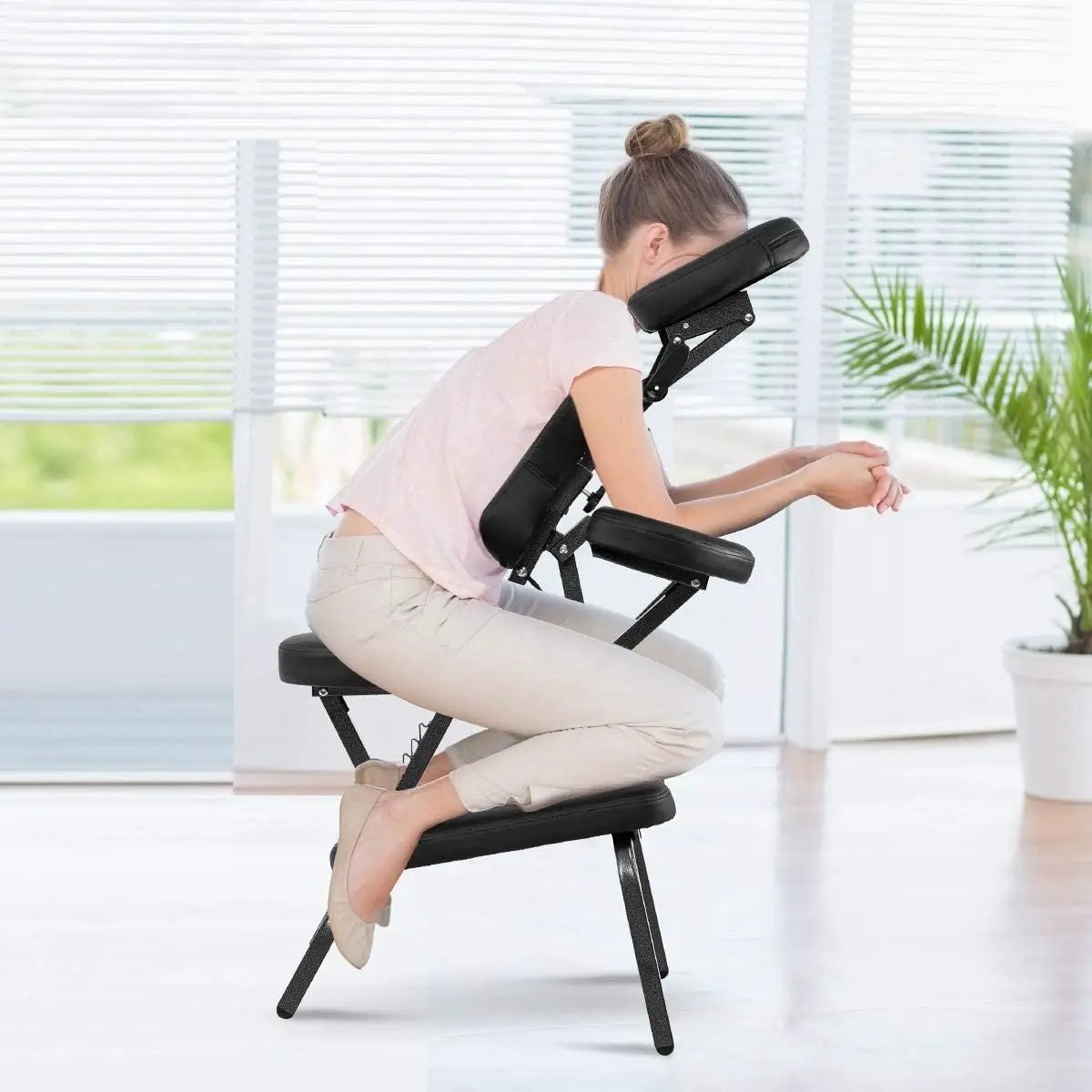 Black portable massage tattoo chair with padded armrests, headrest, HomePacific, folding design on Tampa Home & Garden Store