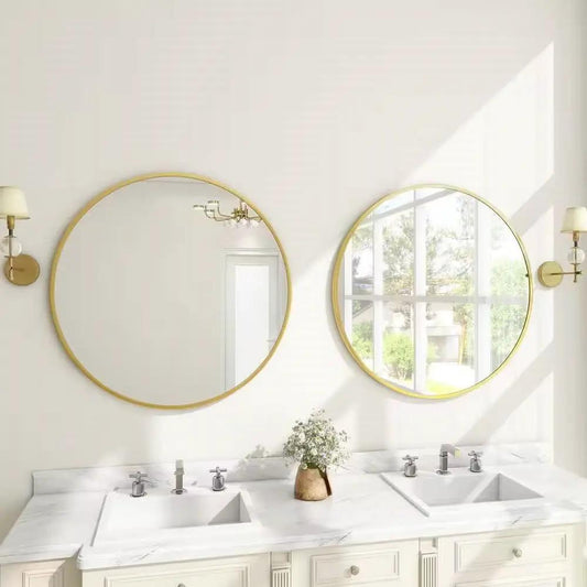 Pair of round 30-inch bathroom mirrors with gold frames by HomePacific above a marble vanity on Tampa Home & Garden Store