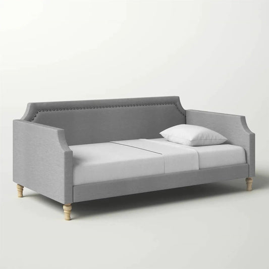 Twin grey polyester daybed with nailhead trim and curved arms on light wood legs on Tampa Home & Garden Store